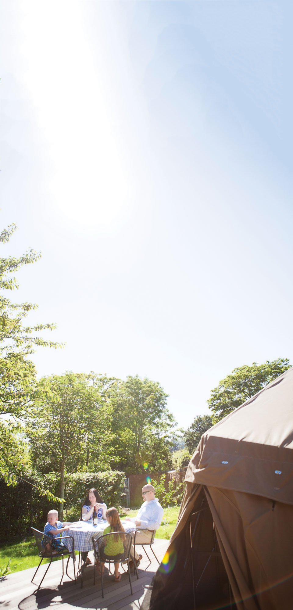 Family have lunch outside their dome at Durrell Wildlife Camp