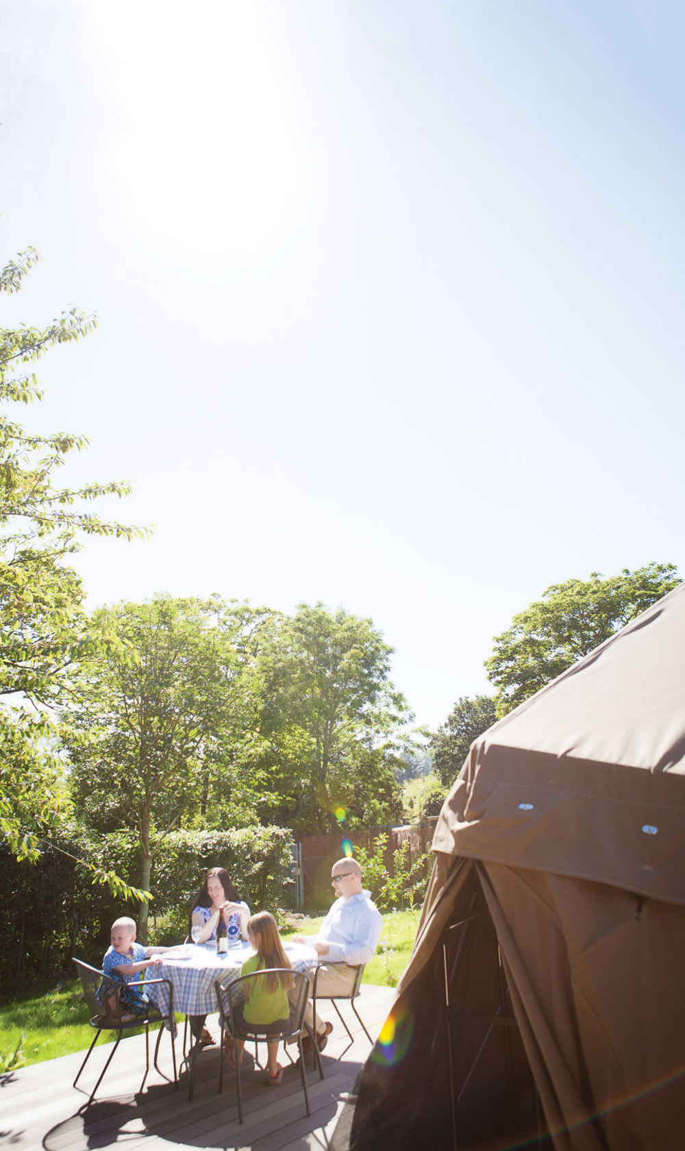 Family have lunch outside their dome at Durrell Wildlife Camp